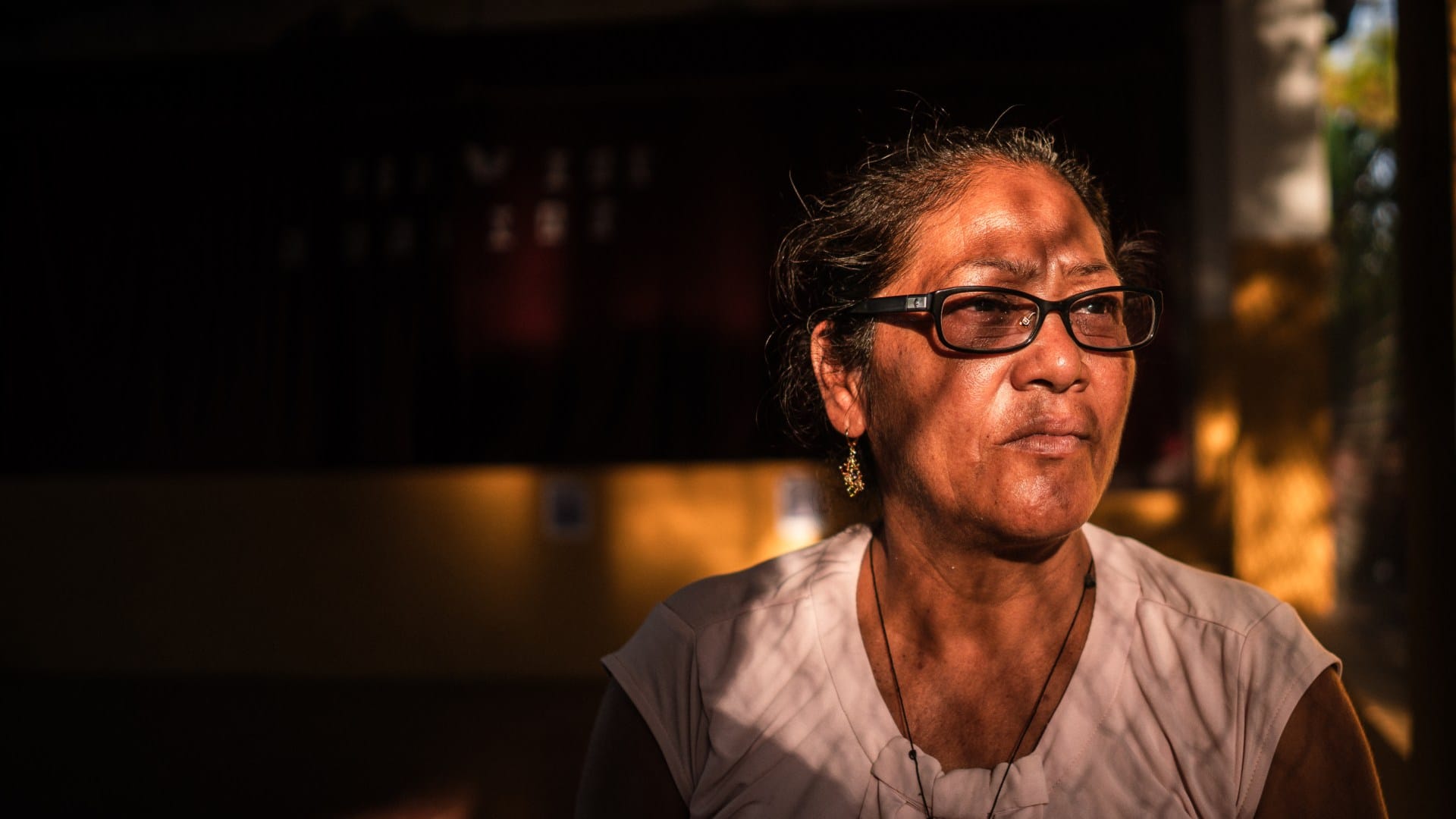 Sara de Perez, 54, one of the mothers of those imprisoned under the state of emergency, pictured in the courtyard of El Rosario's church, El Salvador [Euan Wallace/ Al Jazeera]